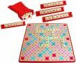 A colorful Scrabble game set by Winning Moves, featuring a vibrant game board adorned with letters and symbols, a bag of letter tiles, and scoring strips. Perfect for family game nights and word enthusiasts.