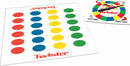 Twister game set by Winning Moves, featuring a colorful mat with red, blue, yellow, and green circles, accompanied by a spinner that dictates hand and foot placement.