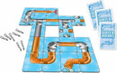 Waterworks game by Winning Moves featuring colorful jigsaw pieces representing pipes and valves. The game includes cards and installation hardware, ideal for family fun.