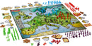A vibrant game board for Risk Europe featuring a detailed map of Europe. Various colored armies, including red, blue, green, and purple, are positioned on strategic territories. Accompanying elements include cards, dice, and game pieces, all arranged around the board, creating an engaging setup for strategic gameplay.