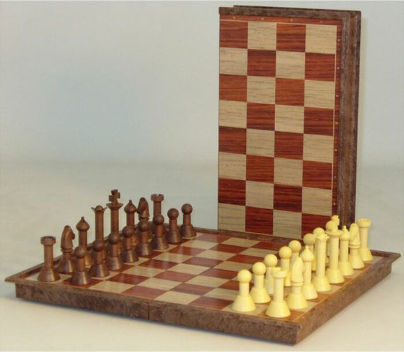 An 11-inch magnetic chess set from John N. Hansen Co. Inc., featuring a beautiful wooden board with alternating light and dark squares. The set includes finely crafted chess pieces in two contrasting colors, neatly arranged for play. The board stands upright, showcasing its elegant design for display when not in use.