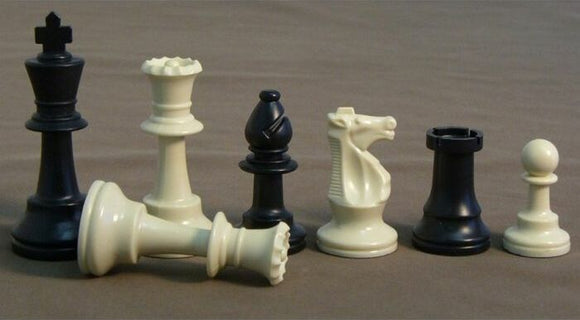 A set of 3.75-inch plastic triple weighted chessmen in black and ivory colors, showcasing the various pieces including the king, queen, knight, and pawns, arranged neatly in a line for a classic game of chess.