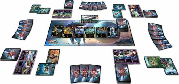The Star Realms Box Set by Wise Wizard Games displayed on a table featuring a vibrant space-themed game board, various cards laid out, and colorful artwork. The game setup includes different factions and ships ready for intergalactic battles, ideal for strategic gameplay with friends or family.