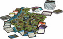 A tabletop game setup featuring the D&D: Ghosts of Saltmarsh Adventure. The game includes a detailed game board with tiles depicting a coastal setting, various cards laid out indicating different actions, and several miniature figures representing characters and creatures. The scene conveys an immersive gaming experience with a variety of strategic elements.