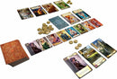 Citadels Revised Edition by Z-Man, featuring a colorful array of character and location cards spread across a tabletop. Coins are arranged neatly as players strategize. The game box is partially visible, showcasing its detailed design. This engaging strategy card game involves players taking on different roles to build their medieval city.