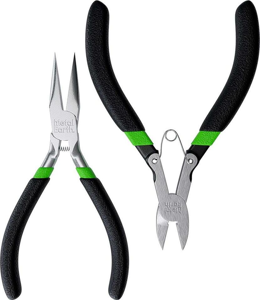 A tool kit featuring two pairs of pliers with black handles and green accents. One pair has pointed tips for precision work, while the other has flat tips for gripping. Ideal for DIY projects and intricate tasks, this enhanced design is perfect for hobbyists and professionals alike.