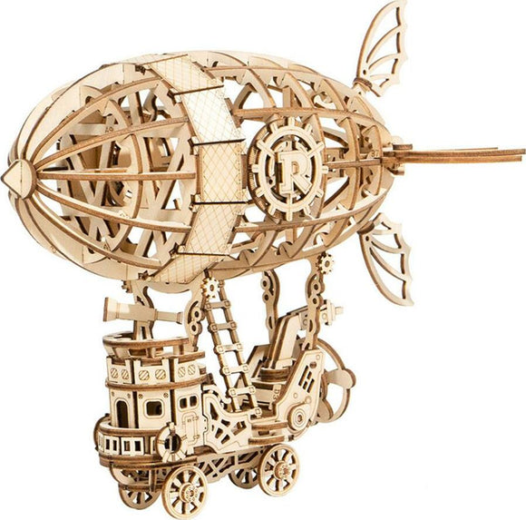 A detailed wooden 3D puzzle kit of an airship designed by Robotime. The model features intricate cut-out designs, a propeller, and decorative sails, all crafted from natural wood. The airship is mounted on a wheeled base, showcasing gears and other mechanical elements that highlight its steampunk aesthetic, ideal for DIY enthusiasts and puzzle lovers.