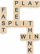 Bananagrams game tiles arranged in a crossword format, featuring words like 'FAST', 'PLAY', 'SPLIT', 'WIN', and 'THINK'. The tiles are square, beige with black letters, showcasing the fun and fast-paced nature of the game.