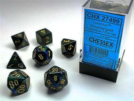 A set of Lustrous Shadow/gold polyhedral dice from Chessex, displayed in a clear box. The seven dice feature a glossy black finish with shimmering gold numbers. The set includes various dice shapes typically used in tabletop role-playing games, showcasing a d20, d12, d10, d8, d6, and d4. The packaging is labeled with the product name and details, emphasizing its quality and appeal for gaming enthusiasts.