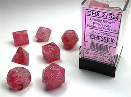 A set of Ghostly Glow pink and silver polyhedral dice by Chessex, featuring seven uniquely shaped dice, including a d20, d12, d10, d8, d6, d4, and a percentile die. The dice are semi-transparent, allowing the pink color to glow with silver numbering, displayed in a clear plastic box with a pink label.