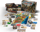 Ticket to Ride Legacy - West board game by Days of Wonder displayed with its components. The image shows the game box, colorful maps, trains in various colors, cards, and tokens arranged on a table, showcasing the vibrant gameplay elements.