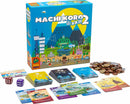 The Machi Koro 2 board game box, featuring colorful artwork of a vibrant city landscape with mountains in the background. The box is open to reveal game components, including cards, dice, money tokens, and a player aid. The game is designed for fun and strategic city-building gameplay.
