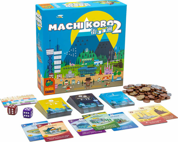 The Machi Koro 2 board game box, featuring colorful artwork of a vibrant city landscape with mountains in the background. The box is open to reveal game components, including cards, dice, money tokens, and a player aid. The game is designed for fun and strategic city-building gameplay.