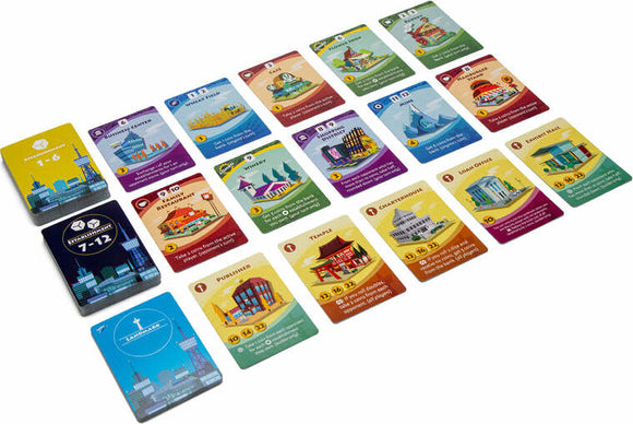 A laid-out display of various colorful cards from the game Machi Koro 2 by PANDASAURUS GAMES. The cards depict different buildings and landmarks, each with unique artwork and numerical values indicating points or resources. The composition showcases a playful, strategic card game environment where players build a city and compete to earn the most points.