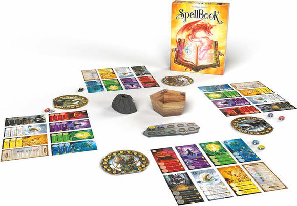 The SpellBook board game by Space Cowboys displayed with its components. The game box is colorful, featuring a mystical dragon and a spell book. Surrounding the box are game cards, tokens, a wooden box, and a rock. Various player boards are arranged, showcasing different colors and abilities, with dice scattered throughout for gameplay.