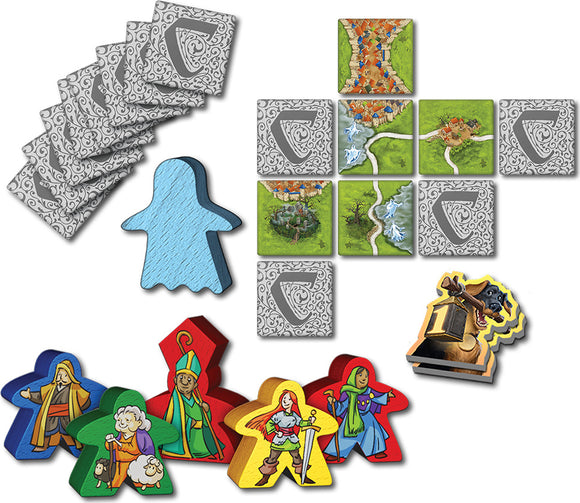 Mists Over Carcassonne board game by Z-Man featuring colorful character meeples, landscape tiles, and a blue ghost-shaped token. The game components are artfully arranged, showcasing the game's vibrant graphics and strategic gameplay elements.
