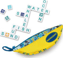 Oceanic Bananagrams game, featuring a vibrant yellow pouch adorned with underwater designs. Scrabble-like tiles are placed on a white surface, forming words related to the ocean such as 'WATER', 'WHALE', 'FISH', 'SAND', and 'OCEAN'. Perfect for family game nights or educational fun.
