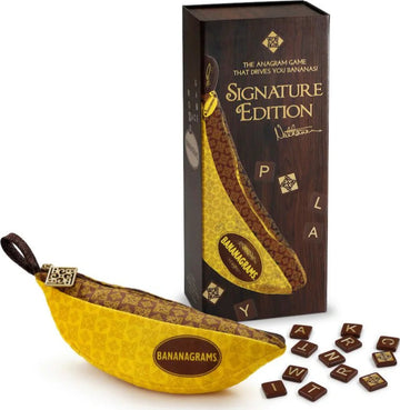 Bananagrams Signature Edition game featuring a yellow banana-shaped pouch containing letter tiles. The packaging is designed with elegant brown and gold accents, showcasing the title 'Signature Edition'. Some letter tiles are displayed out of the pouch, inviting players to engage in anagram challenges.