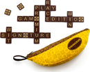 The Bananagrams Signature Edition game features a unique banana-shaped pouch and colorful letter tiles. The game is laid out with tiles spelling 'Bananagrams Signature Edition' in a crossword style, showcasing the fun and educational aspect of the game. Perfect for family game nights or educational activities.