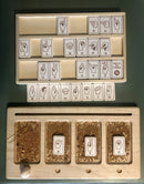 Sign Language Alphabet Tiles by Begin Again features wooden tiles depicting American Sign Language hand gestures for letters A to Z. The game includes a tray for organizing the tiles and provides a tactile way to learn the alphabet through sign language. Ideal for engaging children and promoting early communication skills.