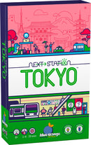 Next Station Tokyo board game by Blue Orange U.S.A. Features vibrant artwork showcasing a Tokyo cityscape with iconic landmarks, designed for 1-4 players aged 8 and up. The box highlights game components and recommended playtime of 25 minutes.