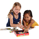 Two children engaged in a playful activity with Pixy Cubes, a mechanical puzzle game. They are smiling as they manipulate colorful cubes and game pieces spread out on a table. The box of Pixy Cubes is visible, showcasing its vibrant design.