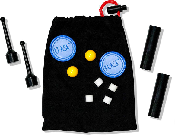 The Klask game by Buffalo Games features a black drawstring bag containing game pieces: two black magnetic striker pieces, two yellow balls, and white magnetic cubes. The bag has a blue circular emblem with the Klask logo, showcasing a fun and engaging game for friends and family.
