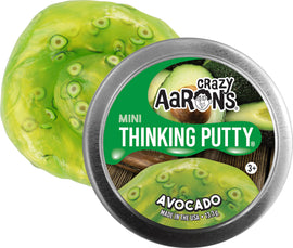 A tin of Crazy Aaron's Mini Avocado Thinking Putty. The putty is a vibrant green color with darker green speckles, resembling an avocado's texture. The tin lid features the brand name and product title prominently, with images of sliced avocados in the background.