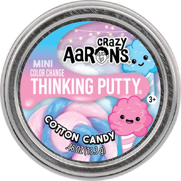 A tin of Crazy Aaron's Mini Color Change Thinking Putty, flavored 'Cotton Candy.' The lid features vibrant pink and blue swirls representing cotton candy, alongside cute cartoon graphics of cotton candy and a blue cloud. The tin contains 0.46 oz (13.3 g) of putty, and is suitable for ages 3 and up.