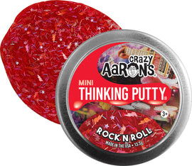 Crazy Aaron's Rock N Roll Thinking Putty, featuring a vibrant red color with sparkling glitter and star shapes. Packaged in a round metal container, it is a fun, tactile toy for ages 3 and up, ideal for stress relief and sensory play.