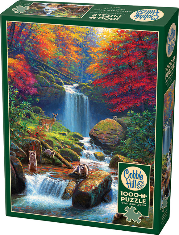 Mystic Falls in Autumn jigsaw puzzle by Cobble Hill featuring a vibrant autumn landscape with a waterfall and wildlife. The puzzle includes 1000 pieces and a poster. The picturesque scene displays colorful trees with red and orange leaves, a serene stream, and playful raccoons and a deer among the rocks, perfect for nature lovers.