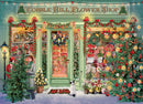 A vibrant jigsaw puzzle featuring the Cobble Hill Flower Shop decorated for Christmas. The scene includes a festive storefront adorned with holiday lights, greenery, and colorful flowers. Two characters are seen interacting, alongside a dog and a beautifully decorated Christmas tree, contributing to a warm, cheerful holiday atmosphere.