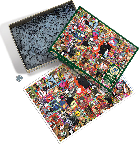 Catsville jigsaw puzzle by Cobble Hill, featuring an intricate collage of colorful cat-themed artwork and vintage illustrations on the puzzle box. The box is open, revealing numerous interlocking puzzle pieces inside, with a preview image of the completed puzzle beside it.