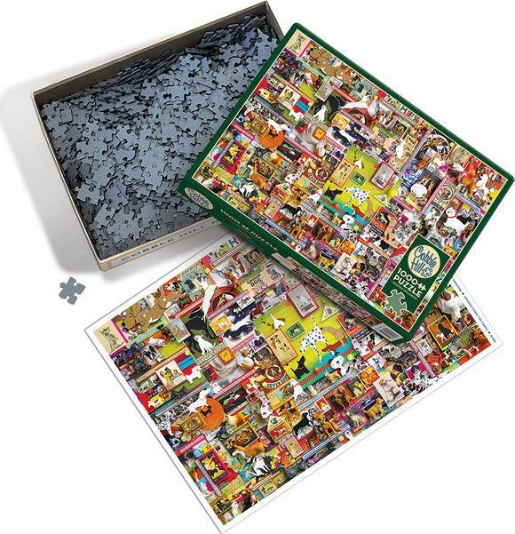 A colorful 1000-piece jigsaw puzzle featuring a vibrant assortment of dog-related images, artwork, and memorabilia, packed in a Cobble Hill branded box. The puzzle pieces are visible inside the box, while the completed image showcases a lively collage of dogs in various poses and settings.