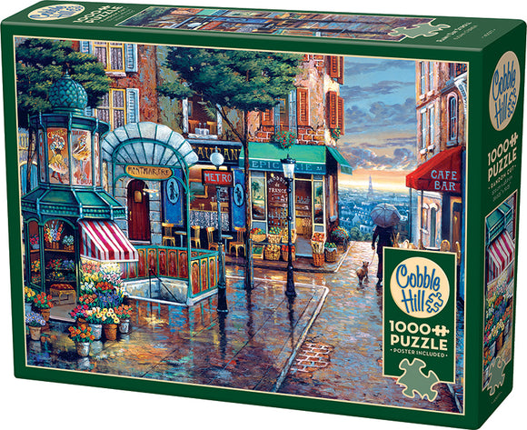 Cobble Hill jigsaw puzzle titled 'Rainy Day Stroll' featuring a picturesque street scene with vibrant shops, a cafe, flowers, and a rainy ambiance. Ideal for puzzle enthusiasts with 1000 pieces and includes a poster for reference.