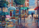 A vibrant jigsaw puzzle depicting a charming Parisian street scene on a rainy day. The illustration features a flower market, café tables, and a couple walking a dog with an umbrella. The colorful buildings and cobblestone path reflect the soft light of a sunset, creating a cozy atmosphere of a French neighborhood.