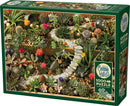 Cobble Hill 1000-piece jigsaw puzzle titled 'Succulent Garden'. The puzzle box features a vibrant image of a lush, detailed succulent garden, showcasing various cacti and succulents in rich colors, arranged in a visually stunning display with pebbles and decorative stones.