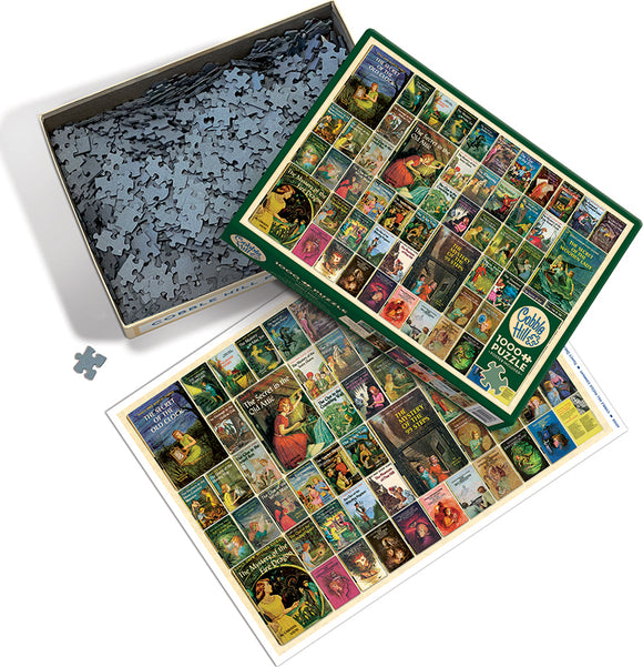 Cobble Hill Nancy Drew jigsaw puzzle featuring various book covers from the popular series. The puzzle box is opened, showing numerous interlocking pieces and a reference image with vibrant artwork from the books. Ideal for fans and puzzle enthusiasts, this 1000-piece set captures the charm of the Nancy Drew mysteries.