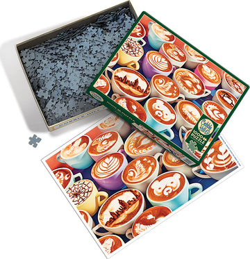 BaristArt jigsaw puzzle by Cobble Hill features an assortment of beautifully crafted coffee cups with intricate latte art designs. The puzzle box shows the colorful array of cups and includes a picture reference of the completed puzzle. There are many puzzle pieces neatly organized inside the box, inviting coffee lovers and puzzle enthusiasts to engage in a delightful challenge.