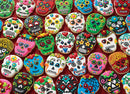 A vibrant collection of sugar skull cookies, beautifully decorated with colorful icing and floral designs. Each cookie features intricate patterns resembling traditional sugar skulls, perfect for festive occasions like Día de los Muertos. The arrangement showcases an array of colors including pink, green, blue, and red, enhancing their festive appeal.