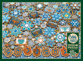 A vibrant jigsaw puzzle featuring a colorful assortment of Hanukkah-themed cookies. The cookies are beautifully decorated with blue and white icing, showcasing various designs, including stars of David, menorahs, and dreidels, all set against a festive background. This Cobble Hill 1000-piece puzzle includes a poster for reference.
