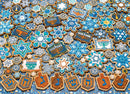 A vibrant jigsaw puzzle featuring an assortment of decorative Hanukkah cookies. The cookies are intricately designed with blue and white icing in shapes such as stars, menorahs, and dreidels, showcasing festive symbols and patterns associated with the holiday. The colorful arrangement creates a visually appealing puzzle that captures the spirit of Hanukkah.
