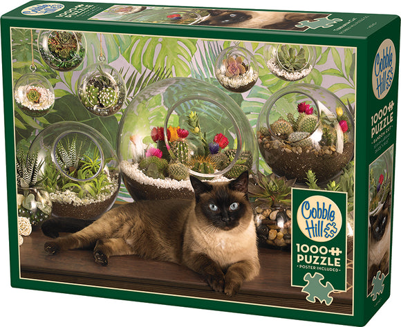 The Cobble Hill Terrarium Cat jigsaw puzzle featuring a charming Siamese cat lounging beside beautifully arranged glass terrariums. The scene is adorned with vibrant plants and colorful flowers, creating a serene yet lively atmosphere. This 1000-piece puzzle comes with a poster included, perfect for nature lovers and puzzle enthusiasts alike.