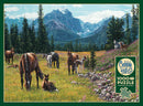 A jigsaw puzzle titled 'Horse Meadow' by Cobble Hill featuring a vibrant landscape. The image depicts a serene meadow with several horses grazing, surrounded by lush grass, colorful wildflowers, and tall evergreen trees. Majestic mountains rise in the background under a clear blue sky, providing a picturesque scene perfect for puzzle enthusiasts.