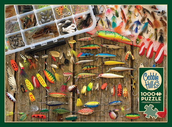 A vibrant jigsaw puzzle featuring an assortment of fishing lures displayed on a wooden background. The image showcases a variety of colorful lures, including spoons, plugs, and flies, alongside a tackle box filled with various fishing components. This 1000-piece puzzle by Cobble Hill is perfect for fishing enthusiasts and puzzle lovers alike, and it includes a poster.