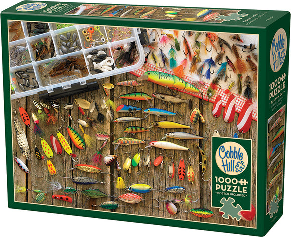 A Cobble Hill jigsaw puzzle featuring an assortment of colorful fishing lures displayed on a wooden background. The image includes a transparent storage container filled with various fishing accessories, like hooks and weights. This vibrant 1000-piece puzzle invites fishing enthusiasts and puzzle lovers to engage in a fun and challenging activity.