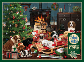 A festive holiday scene featuring various playful puppies surrounded by Christmas decorations. The puppies are in front of a decorated tree, presents, and a cozy fireplace, capturing the warmth and joy of the holiday season. This jigsaw puzzle by Cobble Hill contains 1000 pieces and includes a poster.