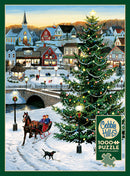 A jigsaw puzzle titled Village Tree by Cobble Hill featuring a picturesque winter village scene. In the foreground, a horse-drawn sleigh carries two children, while a black dog runs alongside. The vibrant Christmas tree is adorned with colorful lights, and the snowy landscape is dotted with cheerful townsfolk, shops, and a softly glowing lamppost. A tranquil bridge spans a frozen river, adding to the festive ambiance.