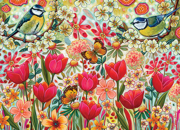 A vibrant, colorful jigsaw puzzle titled 'Shooting the Breeze' featuring a lively garden scene with blooming flowers, butterflies, and two blue and yellow birds perched on branches surrounded by blossoms. The artwork showcases a variety of floral patterns in red, pink, and yellow, enhancing the cheerful atmosphere of nature.