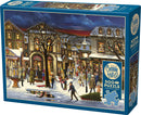 A colorful jigsaw puzzle titled 'Tis the Season' by Cobble Hill, featuring a winter street scene bustling with people, shops, and holiday decorations. The 500-piece puzzle includes a poster for reference.